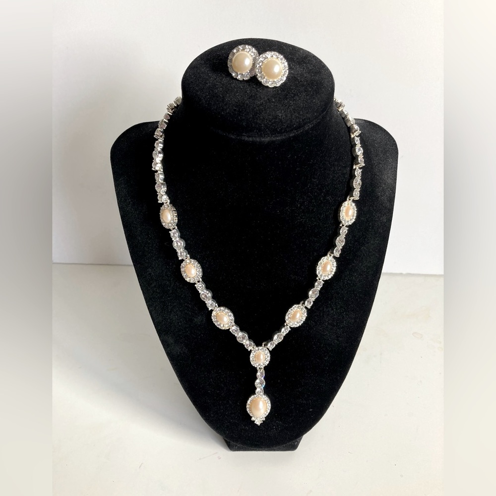 Gorgeous rhinestone and ivory pearl necklace and earring set.